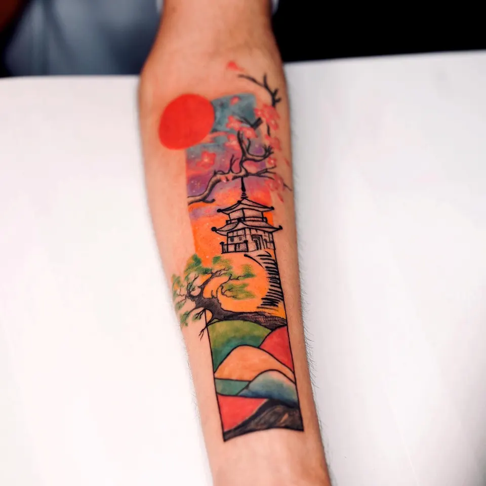 Colour Pagoda Forearm tattoo by Kamz at Kamz Inkzone